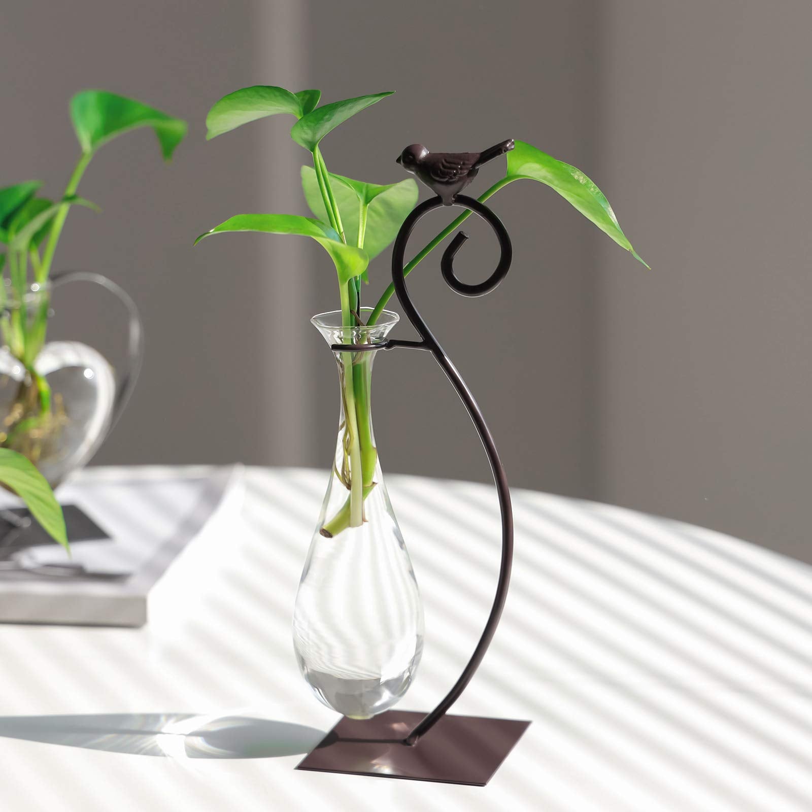 Marbrasse bird-design planter stand enhances home and office decor.