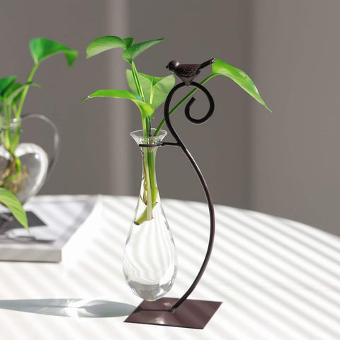 Marbrasse bird-design planter stand enhances home and office decor.
