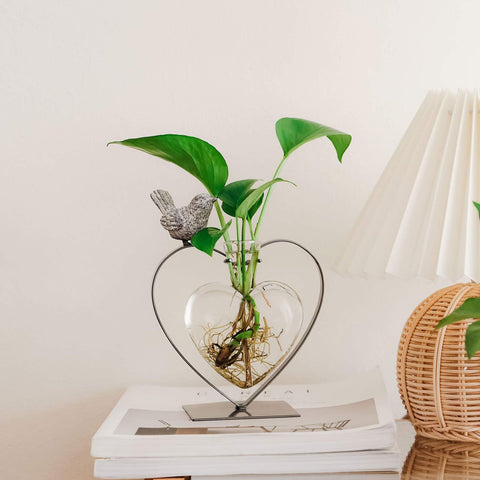 Marbrasse bird frame vase on table creates a chic focal point.