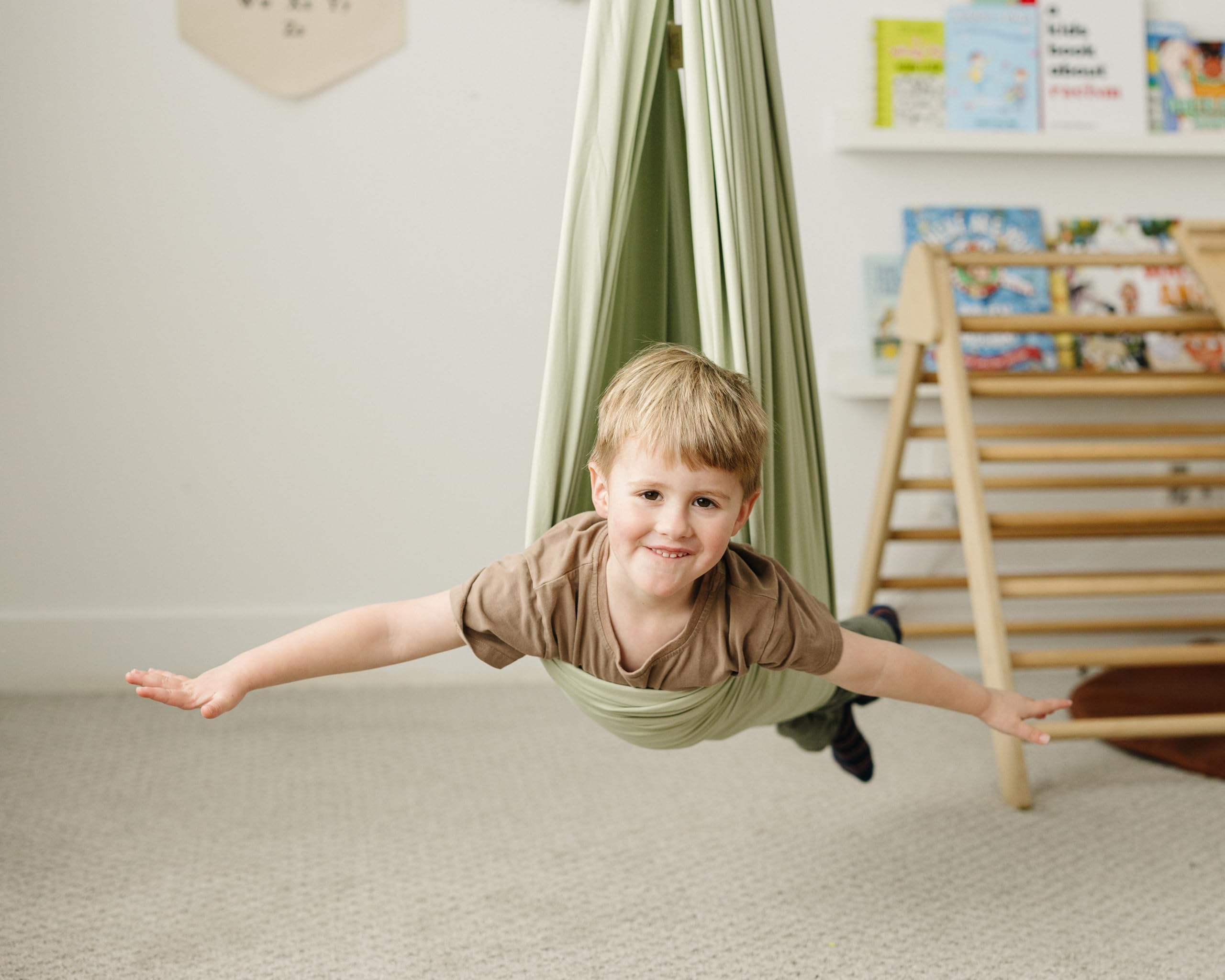Marlowe & Co child enjoying swing demonstrates sensory exploration