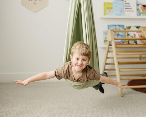 Marlowe & Co child enjoying swing demonstrates sensory exploration