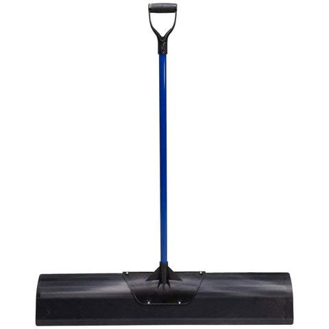 Marshalltown Polar Pusher in use to clear a snowy driveway.