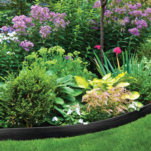 Master Mark weed shield blocks grass from invading planting beds