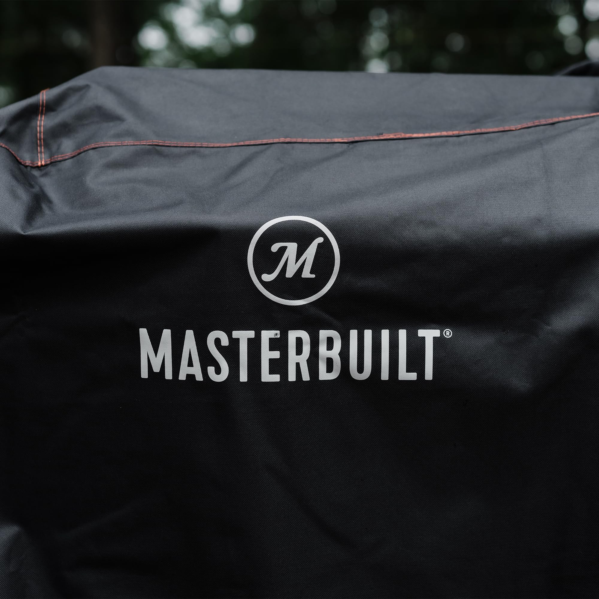 Masterbuilt Gravity Series cover UV-treated fabric shown resisting fading in sunlight