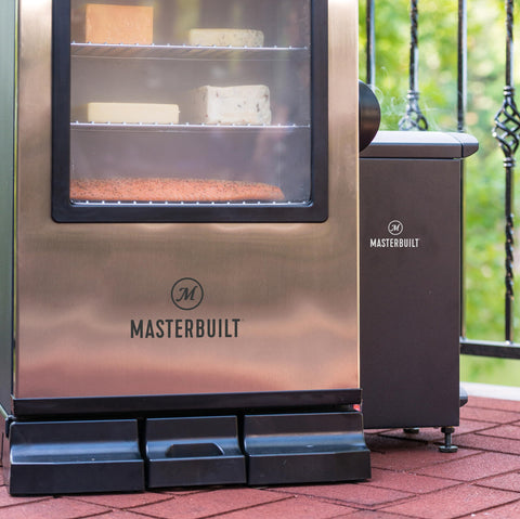 Masterbuilt slow smoker removable ash tray shown for easy cleanup after sessions.