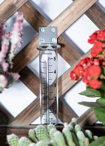 Mateda deck post rain gauge on a rail with clear display.