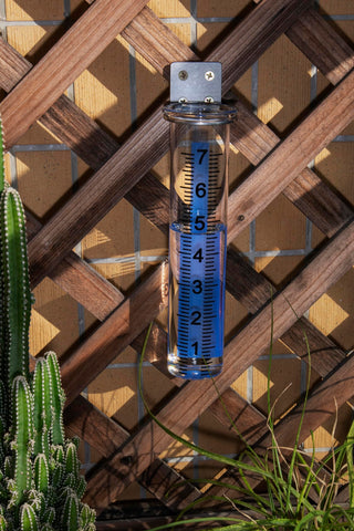 Mateda rain gauge mounted on a deck post for secure placement
