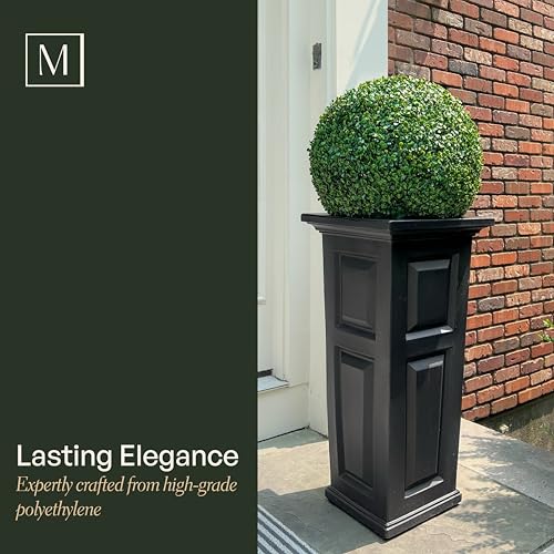 Mayne Nantucket paneled-design planter enhances curb appeal with blooming flowers.
