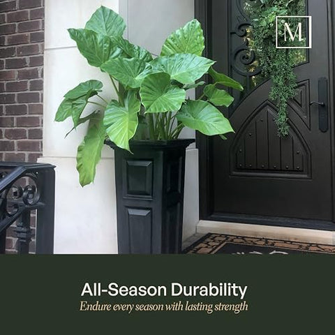 Mayne Nantucket self-watering planter supports healthy flowering display outdoors.