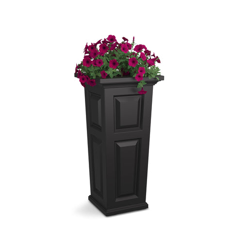 Mayne Nantucket 32-inch tall planter with self-watering system brightens sunlit patio.
