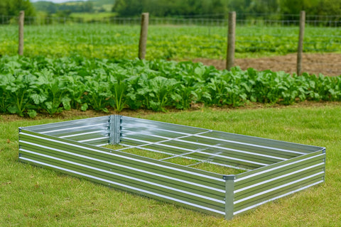 Meberam silver planter box hosting vegetables and herbs on a patio.