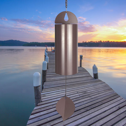 MEDOO Deep Resonance Serenity Bell hanging in a garden for tranquil outdoor ambience.
