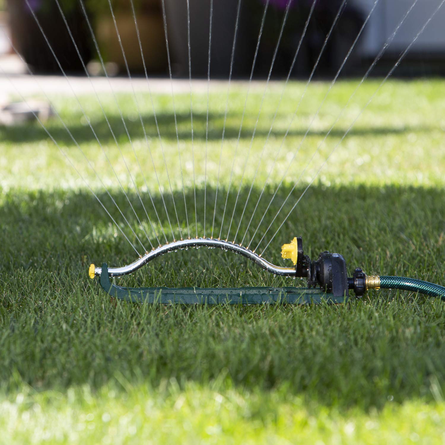 Melnor sprinkler attached to standard hose with threaded end
