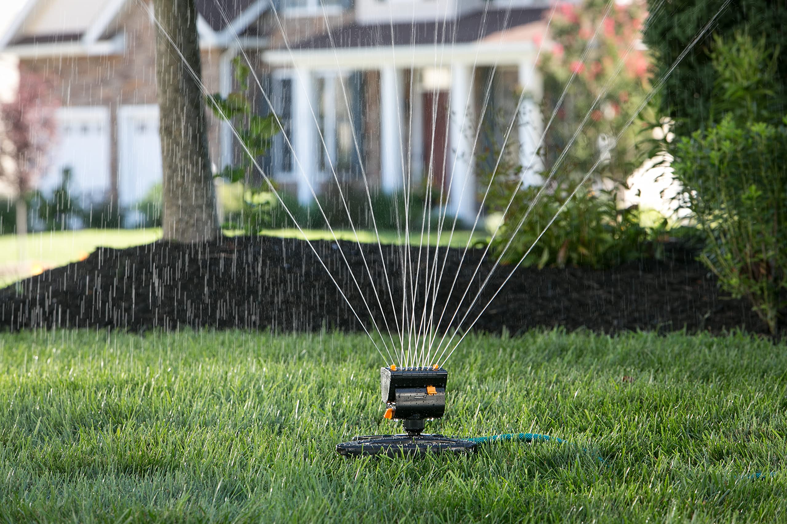 Melnor MiniMax Turbo sprinkler shows four way adjustments for width, range, and flow