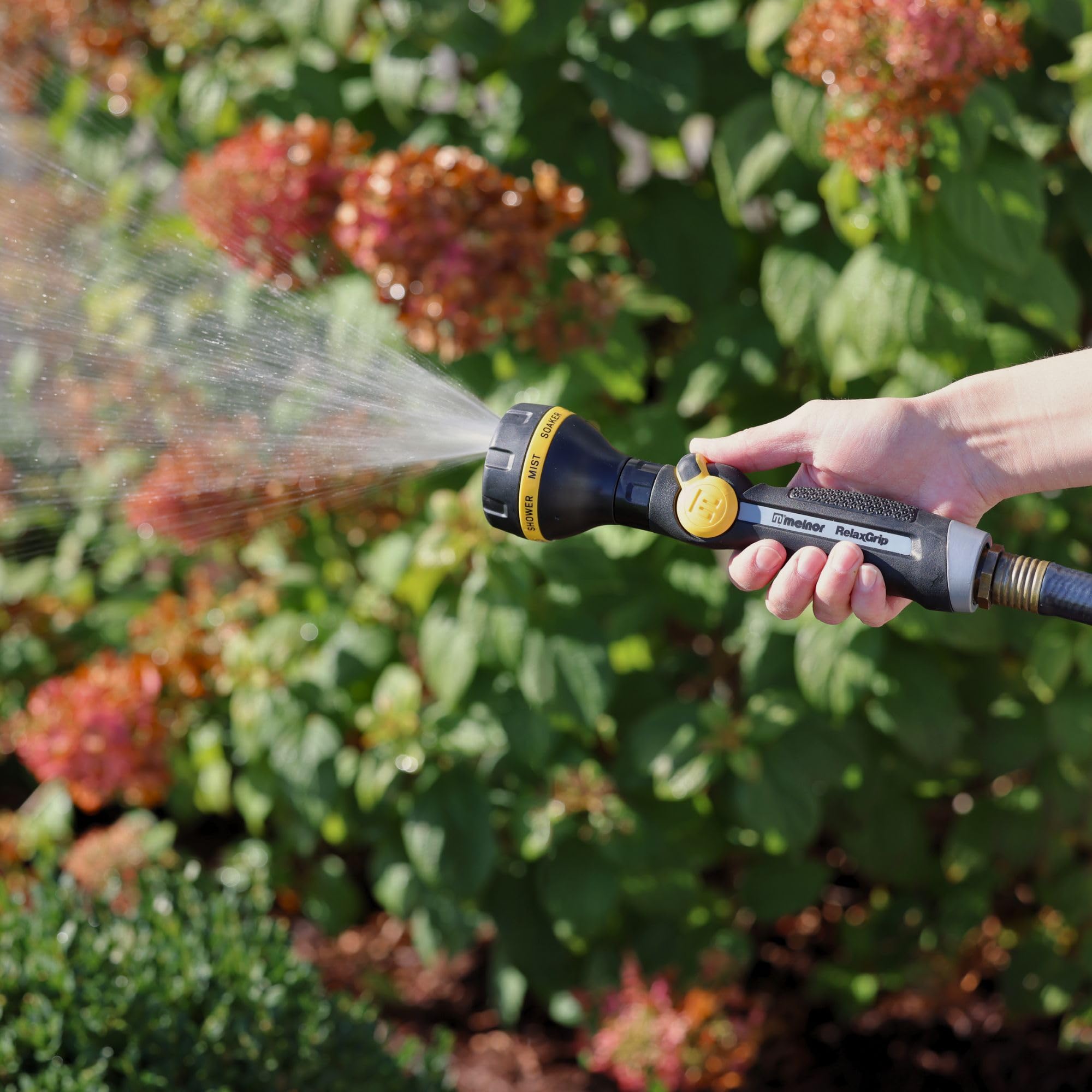 Melnor RelaxGrip handheld grip close-up demonstrates reduced arm strain.