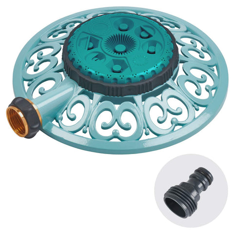 Melnor Sprout 8-pattern sprinkler with a sturdy metal base watering a garden bed.