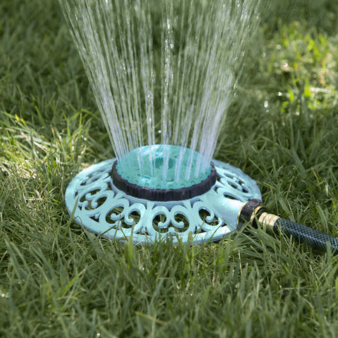Decorative metal base of the Melnor Sprout sprinkler stays steady during use.