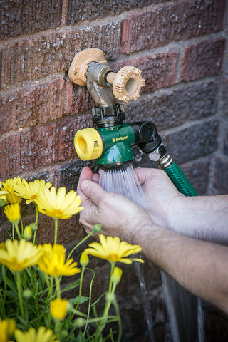 Melnor Wash & Fill spray head enables hands-free washing after gardening.
