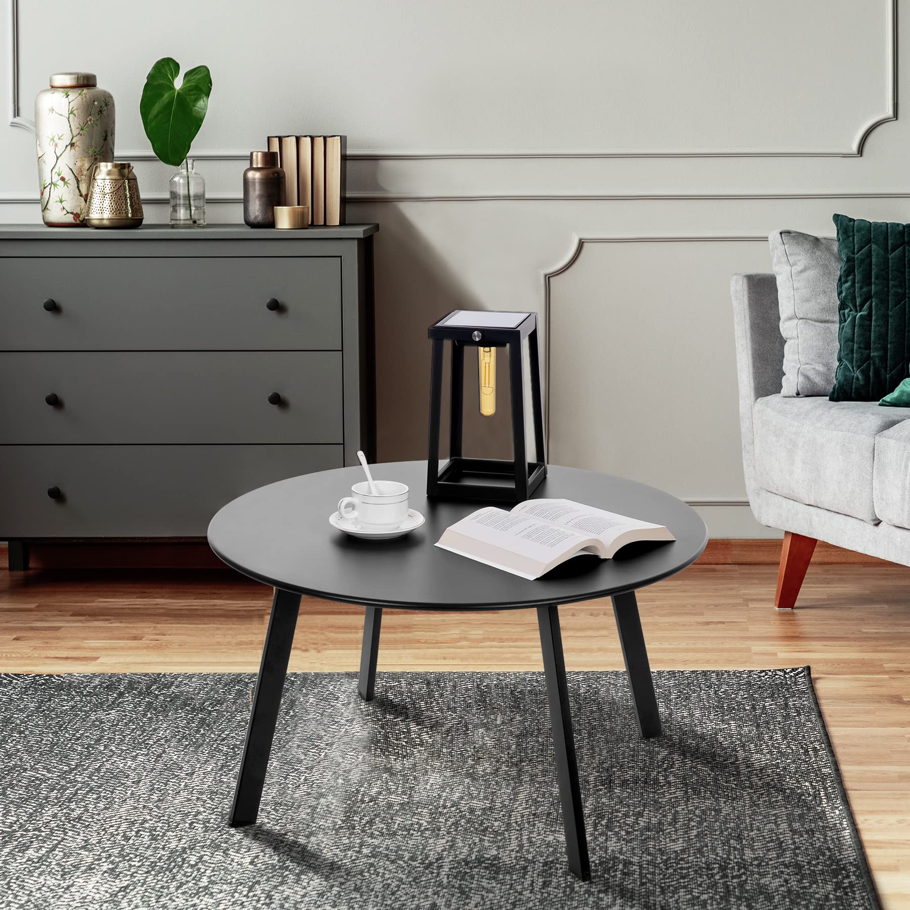 Meluvici weather-resistant metal table with anti-rust finish outdoors.