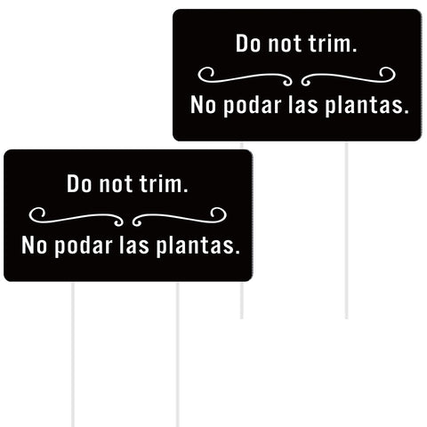 Menkxi yard sign in English and Spanish for clear garden guidance.