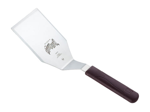 Mercer Hell's Handle in action on a hot pan, heat resistant up to 450°F.