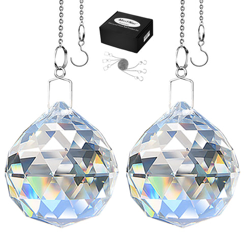 MerryNine crystal ball prism closeup catching sunlight to cast rainbow reflections.