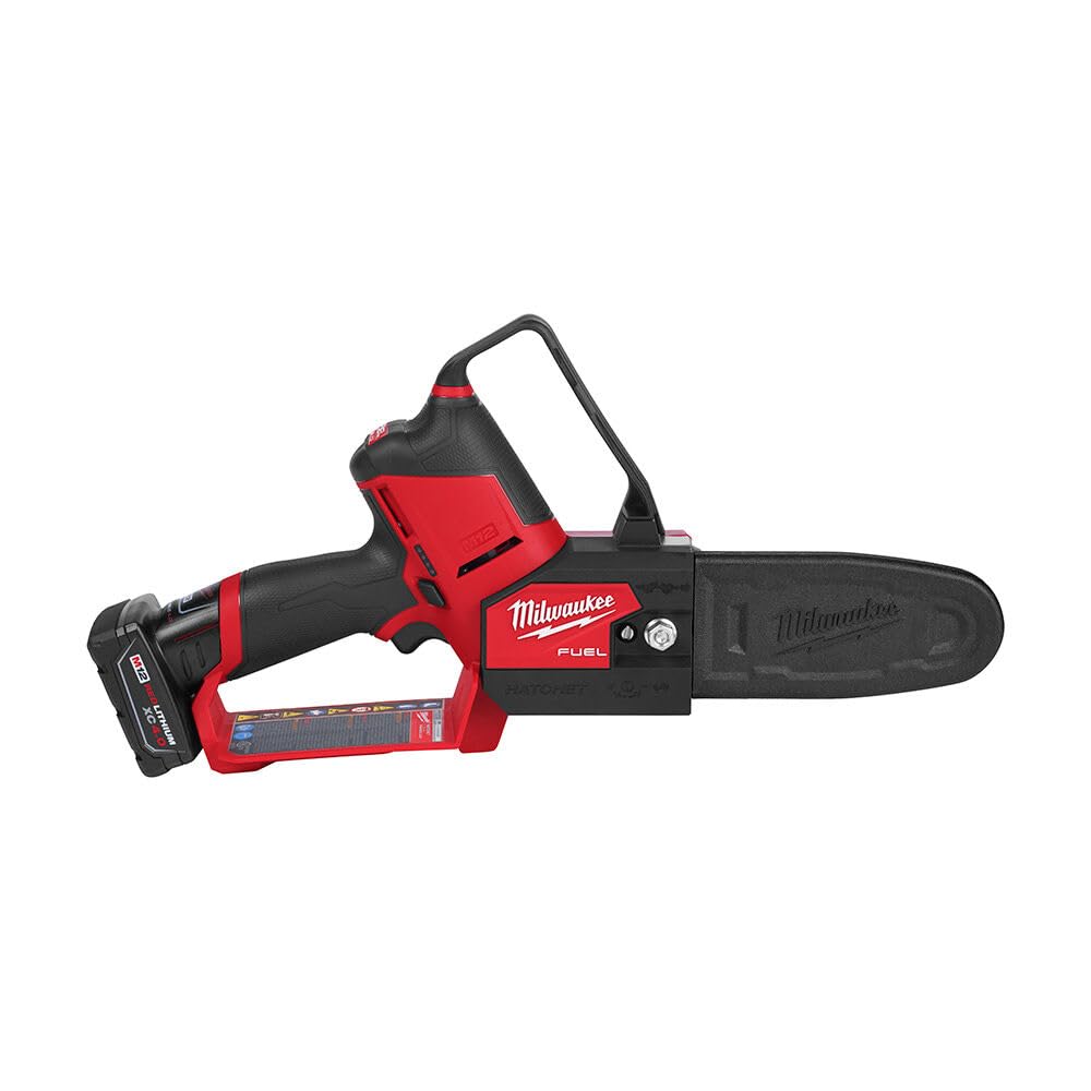 Milwaukee M12 Fuel Hatchet 6in pruning saw in use trimming shrubs.