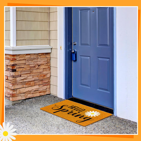 Mindsoft floral welcome mat at entrance adding seasonal charm to entryway.