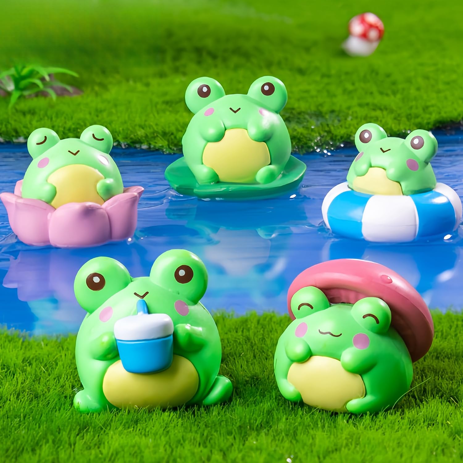Mini resin frog figurines as desktop decor and tabletop charm.