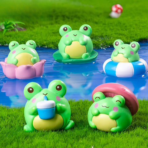 Mini resin frog figurines as desktop decor and tabletop charm.