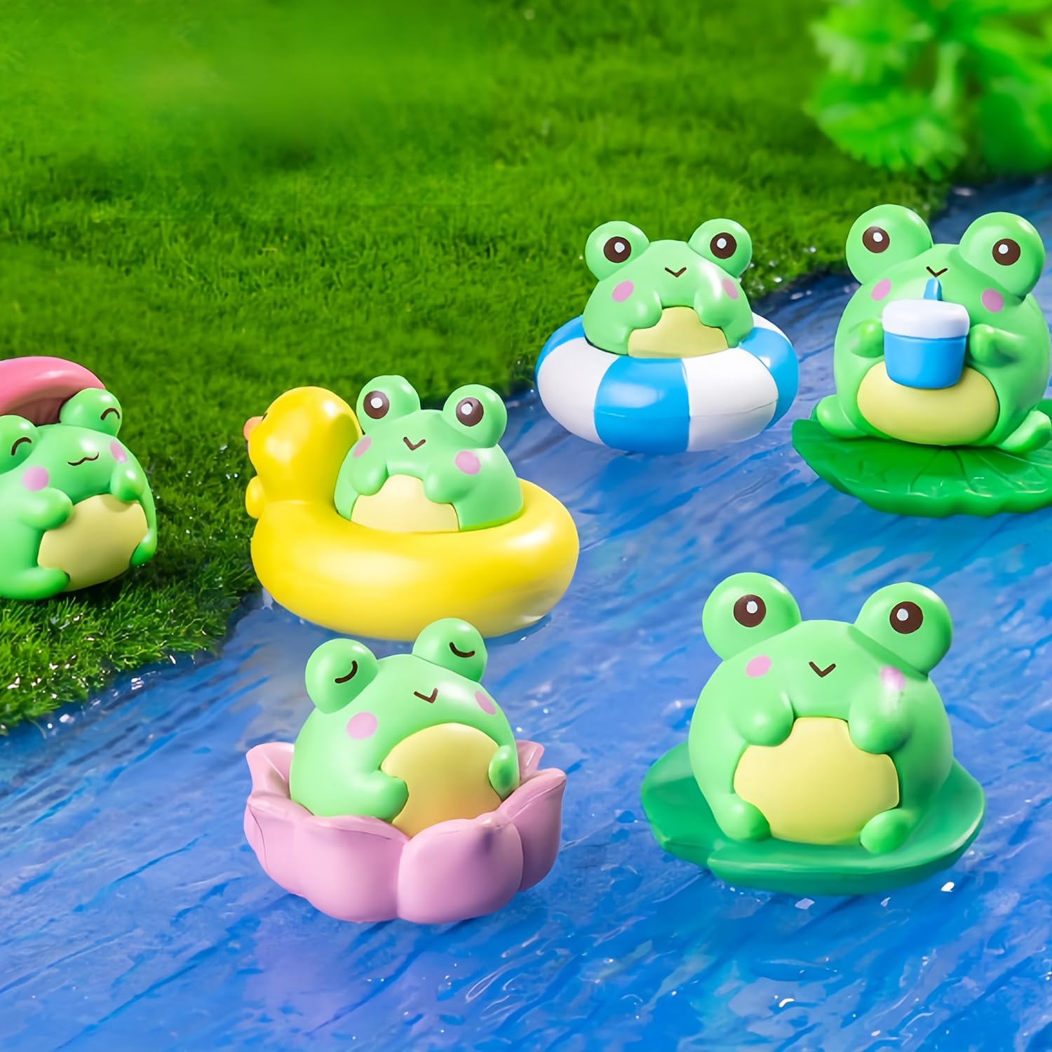 Mini resin frog figurines creating tiny fairy garden scenes.