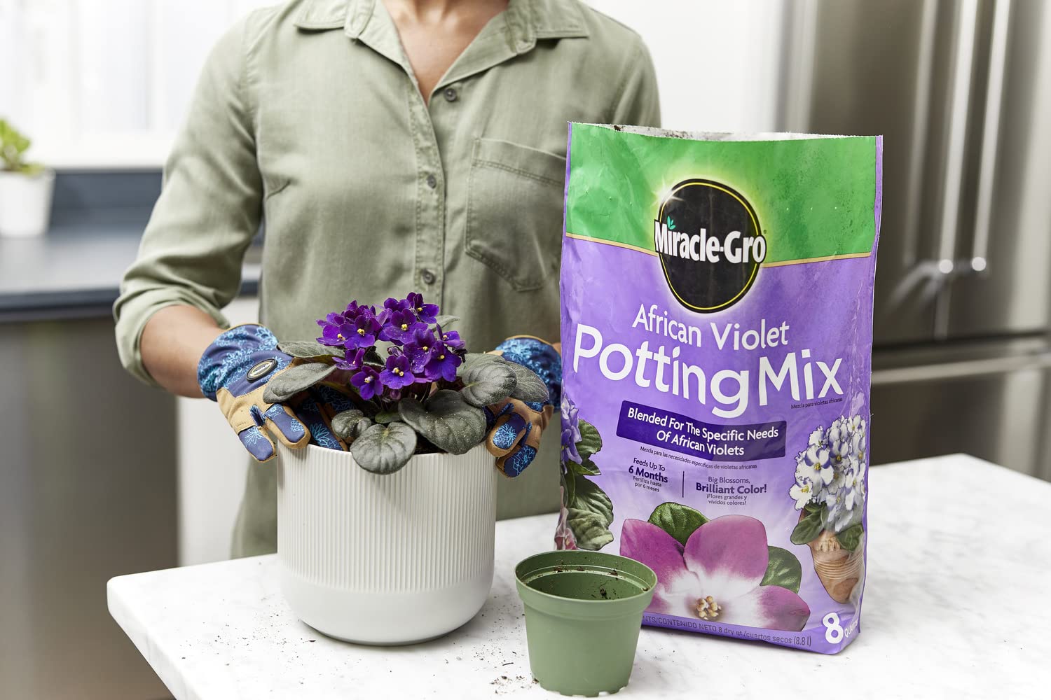 Potting action with Miracle-Gro African Violet mix