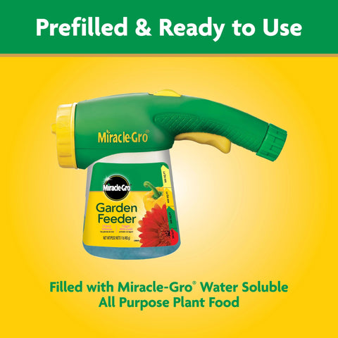 Miracle-Gro Garden Feeder attached to hose during setup.