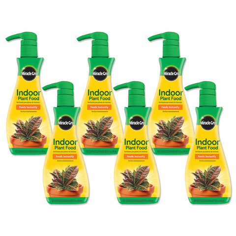 Miracle-Gro Indoor Plant Food bottle boosts healthy indoor leaves.
