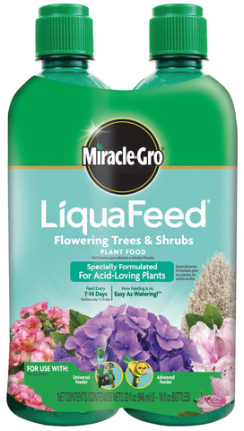 Miracle-Gro LiquaFeed bottle being poured to feed flowering trees and shrubs.