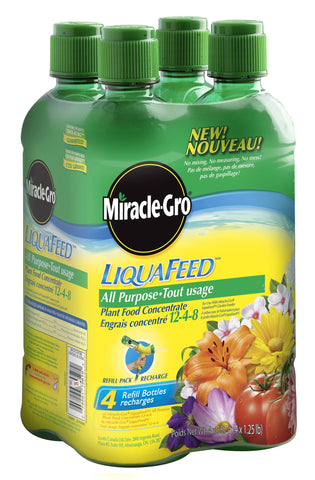 Miracle-Gro LiquaFeed refill bottle for all-purpose fertilizer attached to a garden hose for easy lawn feeding