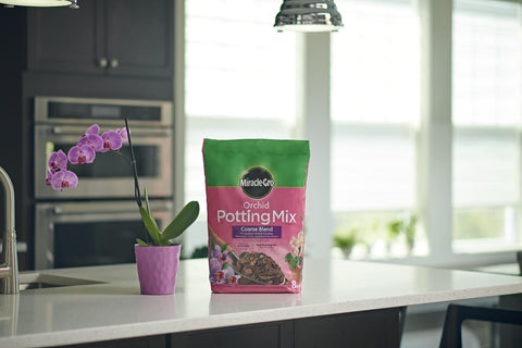 Miracle-Gro orchid mix packaging lists 6-month feeding potential and use cases.