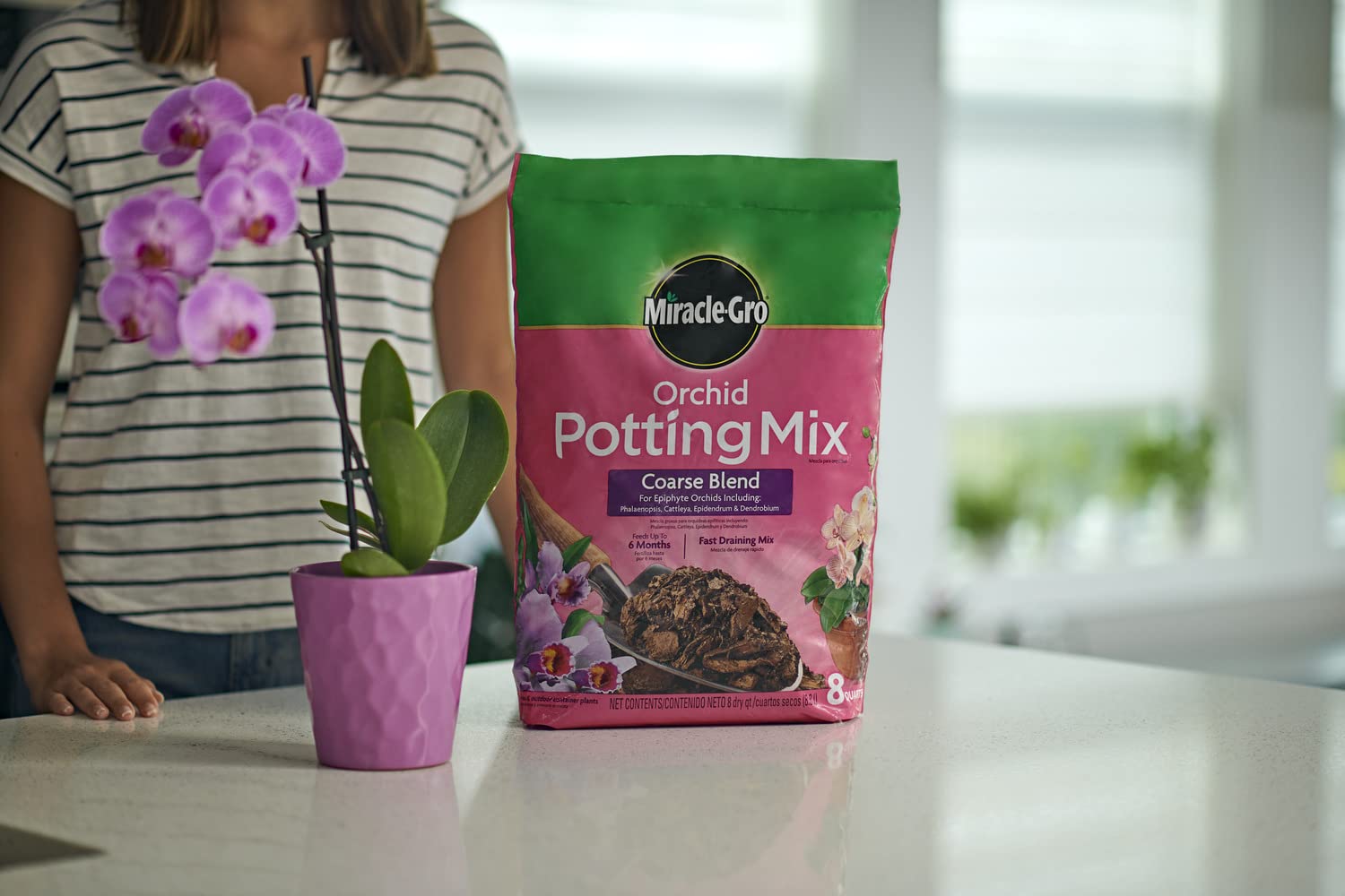 Miracle-Gro mix demonstrates quick drainage suitable for epiphyte orchid care.