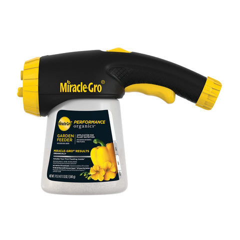 Miracle-Gro Performance Organics Garden Feeder attached to hose for easy feeding.