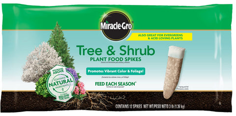 Miracle-Gro simple-to-use spikes being placed by hands