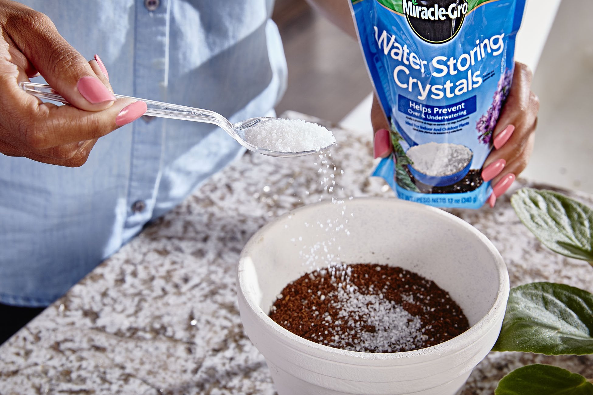 Miracle-Gro Water Storing Crystals mixed into potting soil for container plants
