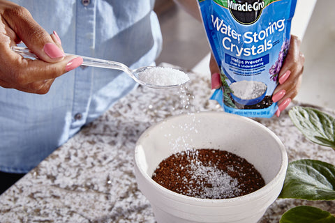 Miracle-Gro Water Storing Crystals mixed into potting soil for container plants