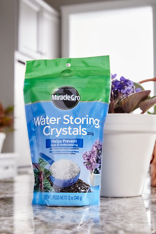 Miracle-Gro Water Storing Crystals dissolving into soil to gradually release water for roots