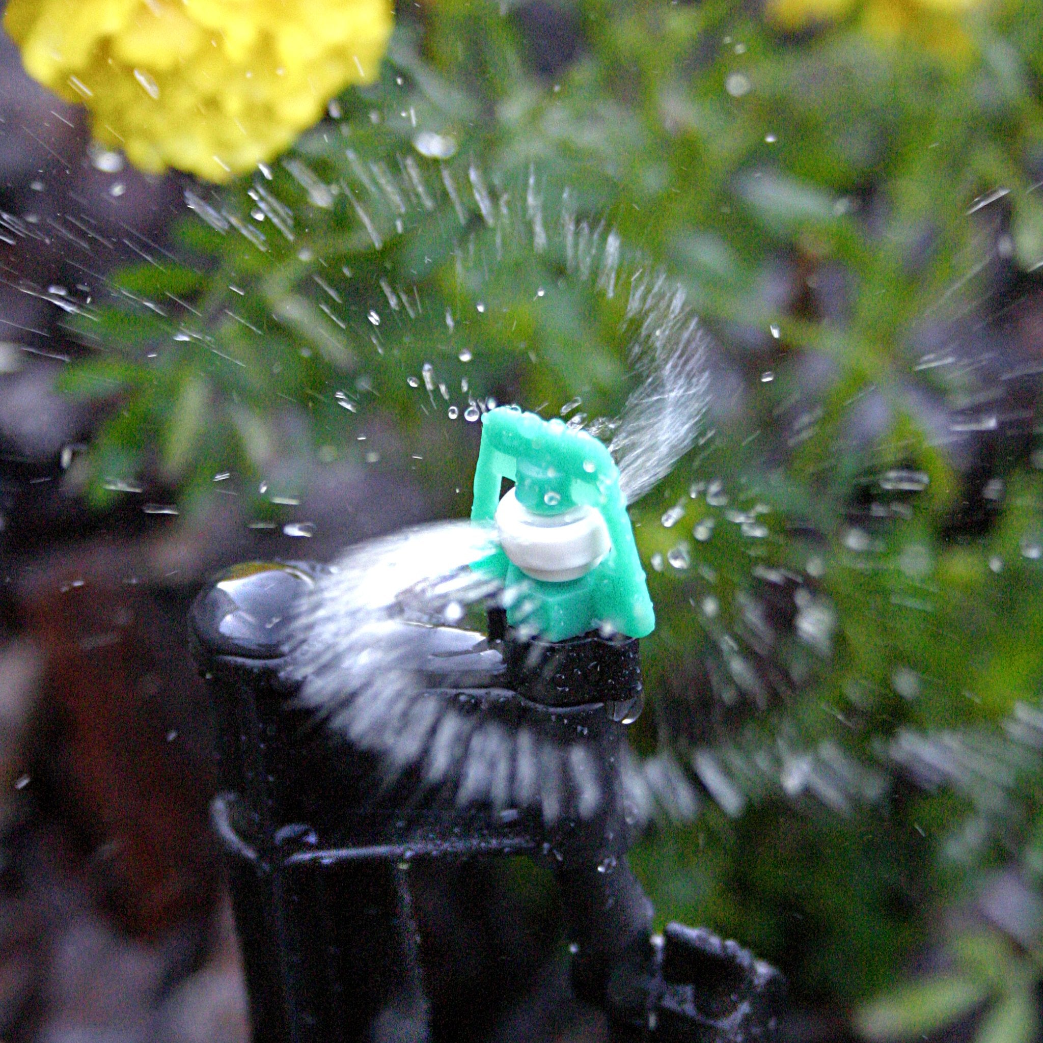 Mister Landscaper MLM-15 center bed irrigation sprinkler spreads water evenly.