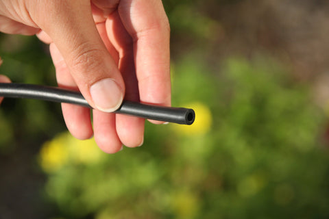 Mister Landscaper 1/4-inch tubing serves as a water supply line to drippers.