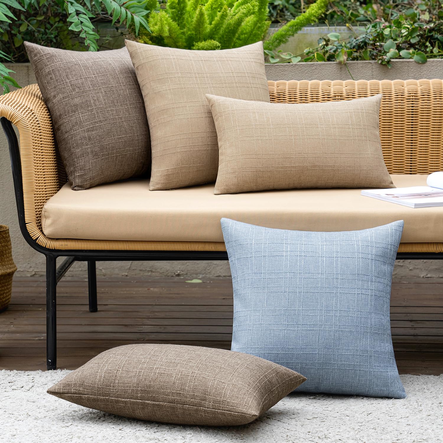 MIULEE pack of 2 pillow covers shown on sofa for living room styling.