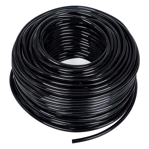 MIXC quarter-inch black distribution tubing for drip irrigation in a garden