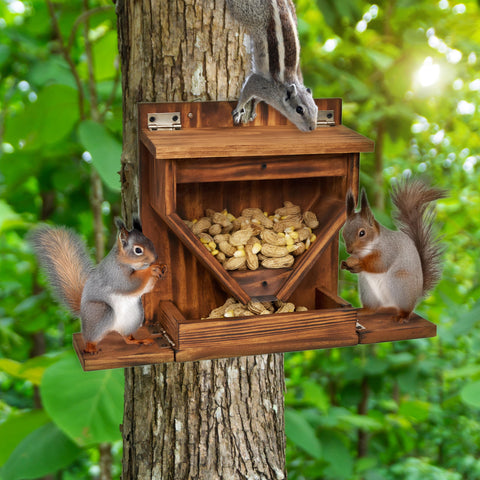MIXUMON wood squirrel feeder being attached to a tree with a screwdriver