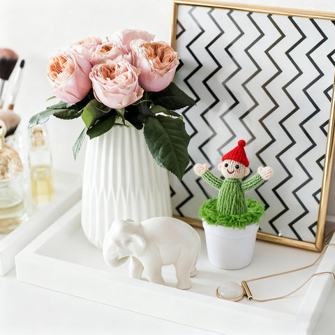 Mizelu home office decor with mini pots adds a warm handcrafted touch.