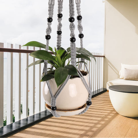 MKO SHUN macrame plant hanger gray bead detail adds decorative texture to room.
